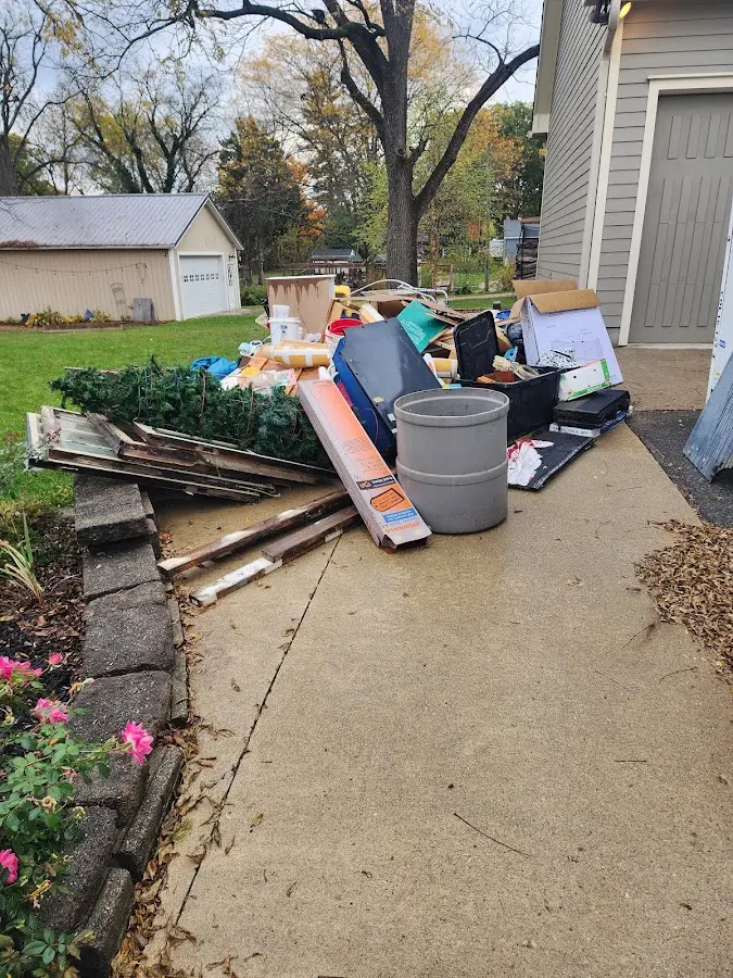 Dumpster being loaded with debris for 3 Yard Dumpster Rental in Jefferson